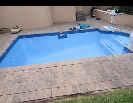 Newly built swimming pool with a fresh blue interior finish